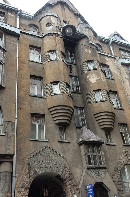 The tenement house designed by the Latvian architect Eižens Laube is characterized by its ethnographic ornaments.